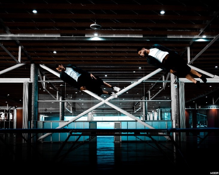 A person floating on a metal bar
AI-generated content may be incorrect.